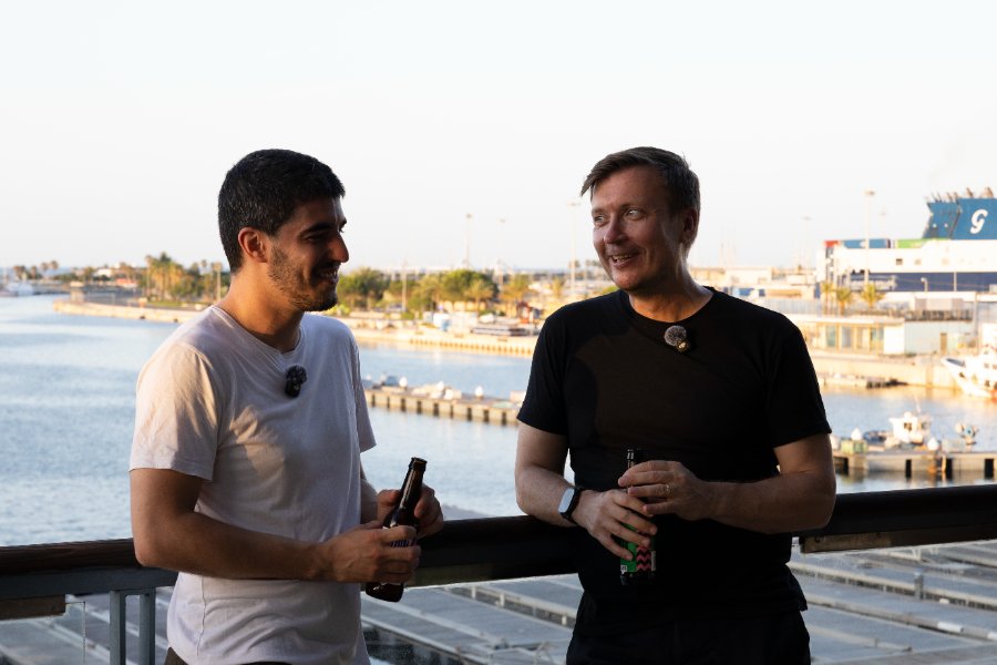 Gerard talking with a builder at the harbor